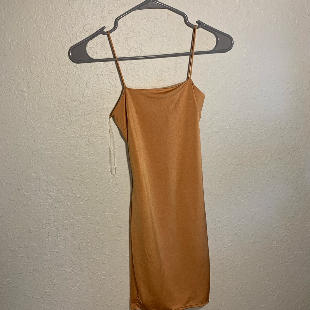 Fashion Nova tight orange dress with a lace back.